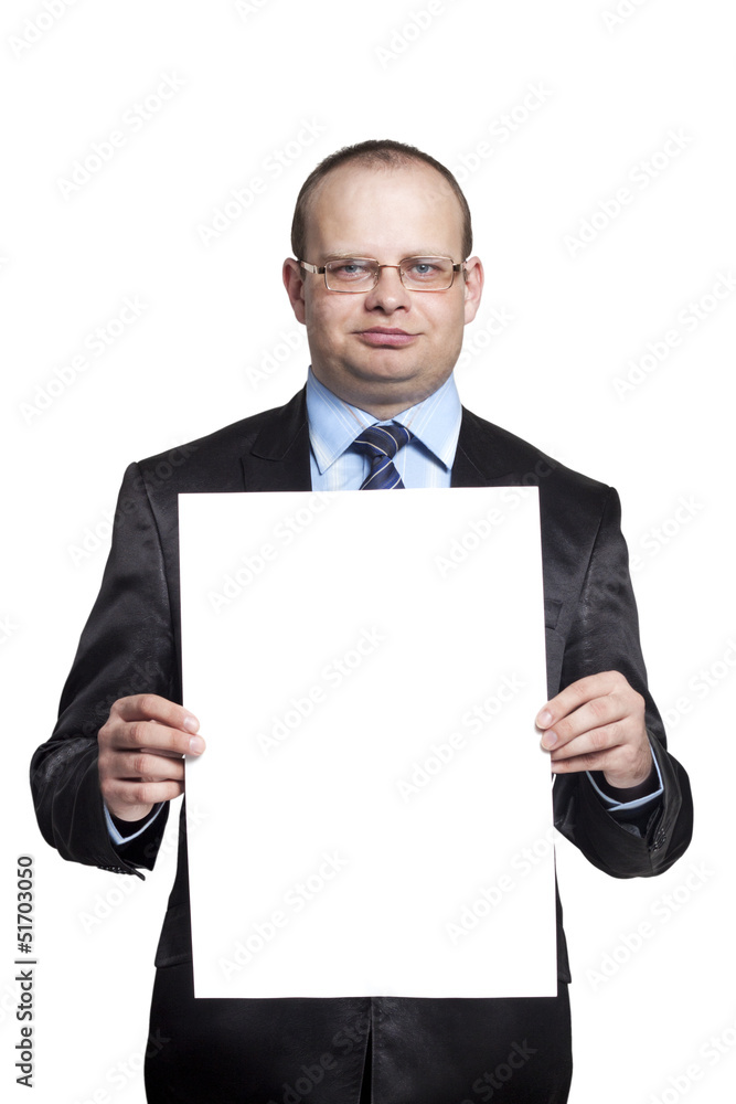 Young man holding a blank sheet of paper vertical Young man holding a blank sheet of paper vertical