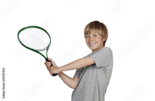 Preteen playing tennis holding racket
