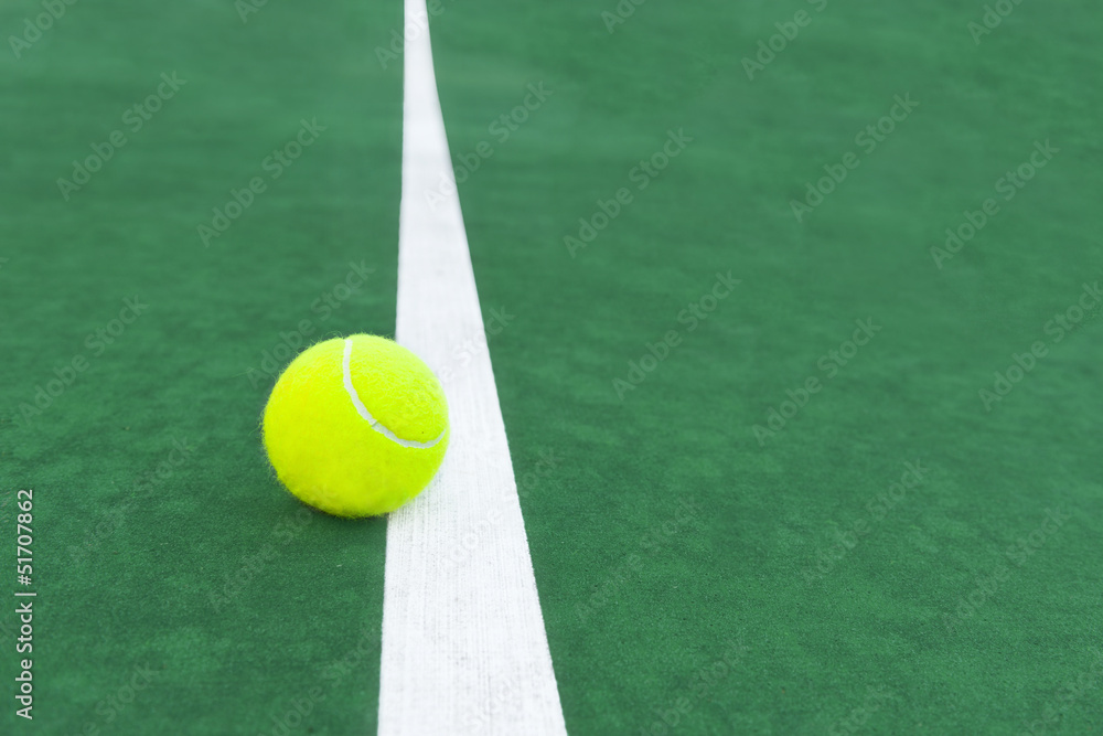 tennis ball on court line