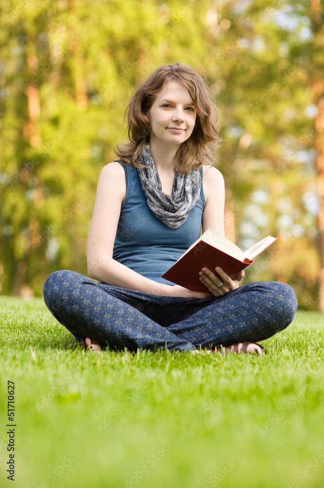 Cute smiling woman holding book Cute smiling woman holding book