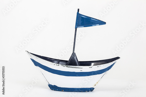 metal toy boat with flag