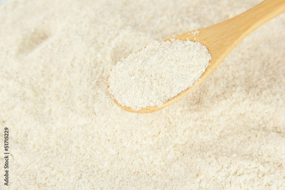 Powdered milk with spoon for baby close-up Powdered milk with spoon for baby close-up