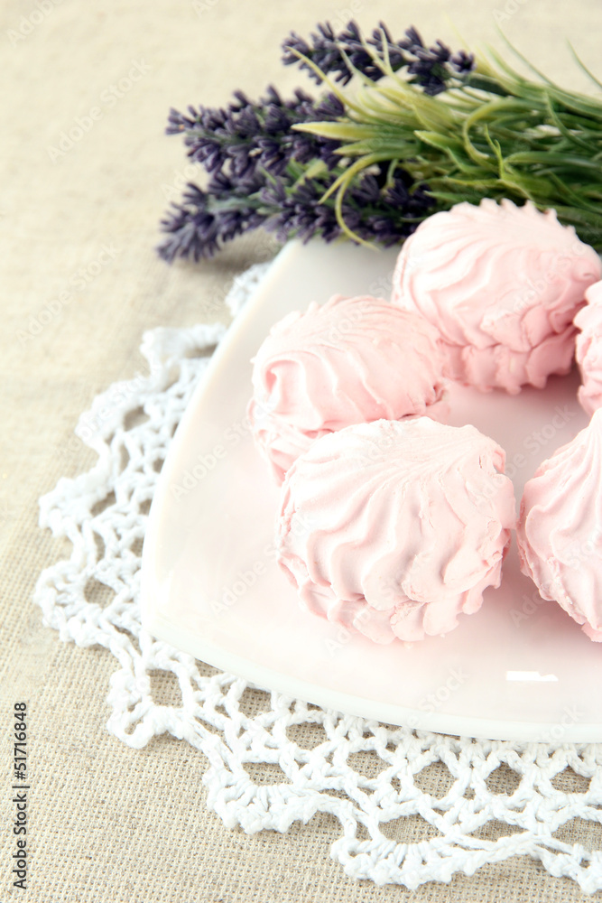 Marshmallows on plate on light background Marshmallows on plate on light background