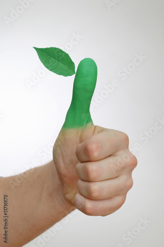 Grüner Daumen mit Blatt photo