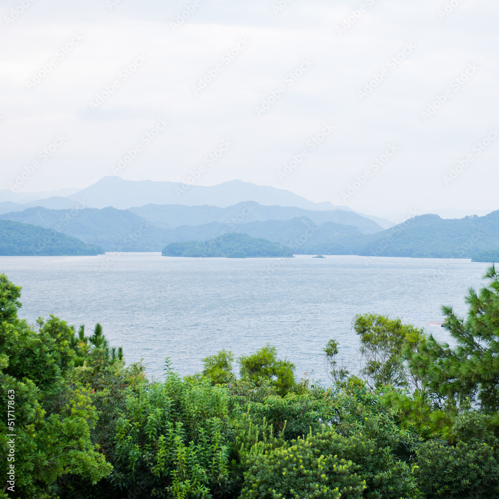 Fototapeta premium mountains surround lake