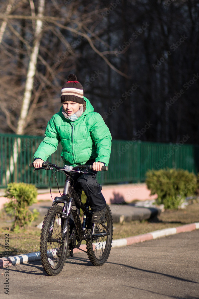 Nice little boy goes by him bicycle Nice little boy goes by him bicycle