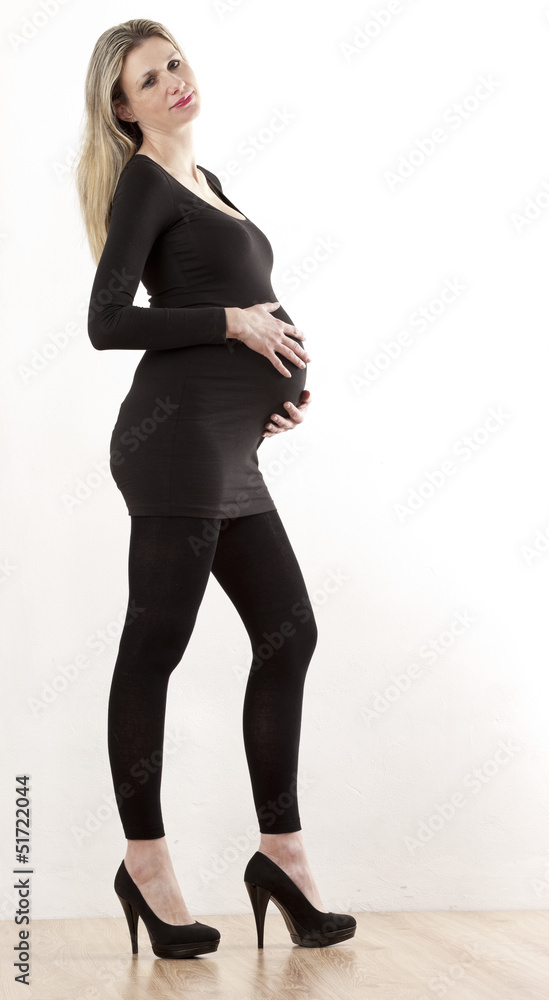pregnant woman wearing black clothes and pumps pregnant woman wearing black clothes and pumps