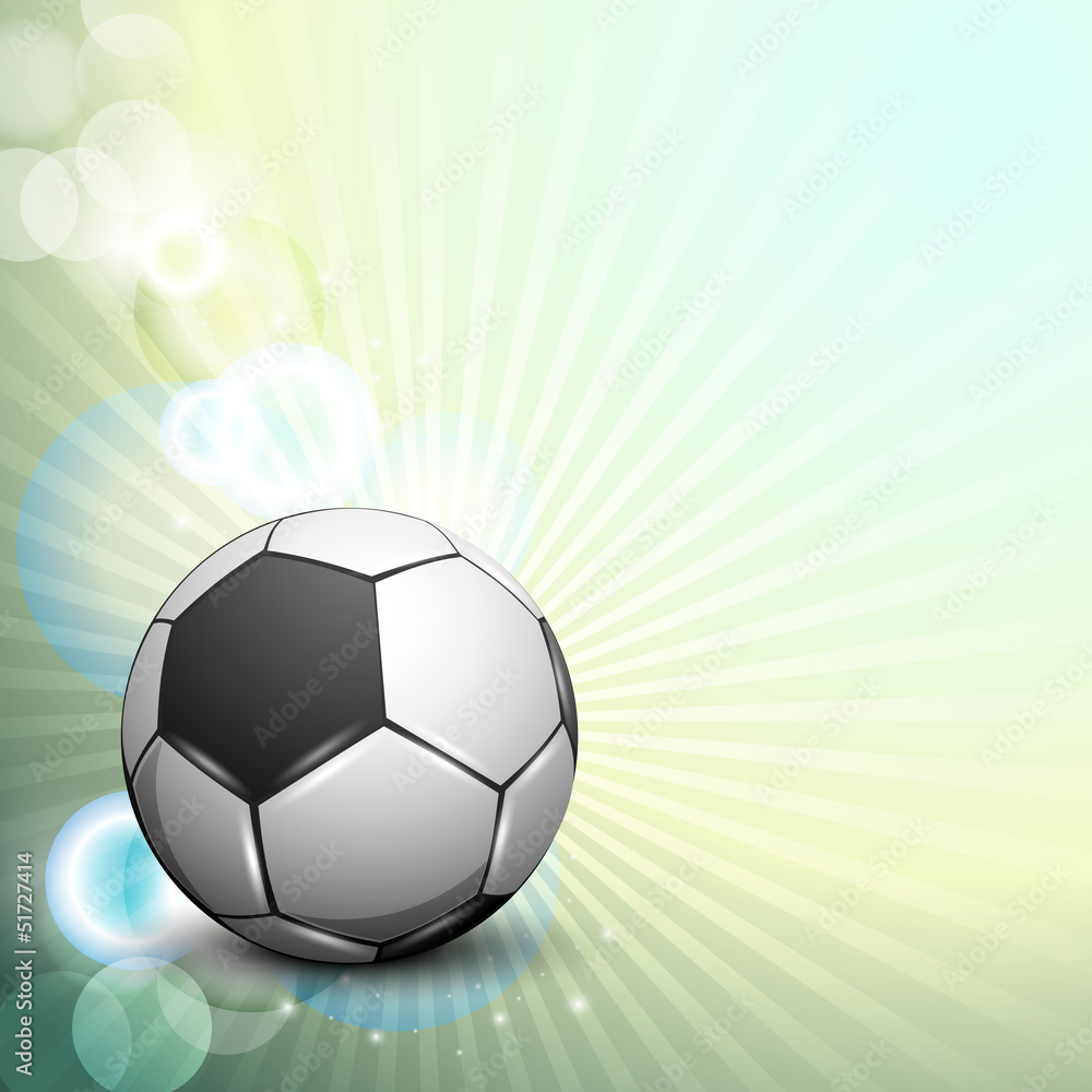 Obraz premium Shiny soccer ball on rays background and space for your message.