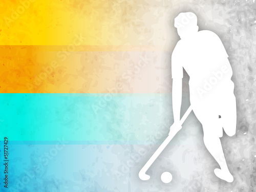 Hockey player with hockey stick and ball on colorful abstract ba