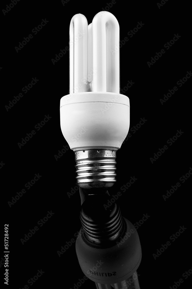 Light bulb on black background, energy saver Light bulb on black background, energy saver