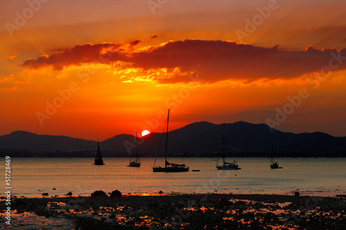 Sunset in Phuket, Thailand a very popular tourist destination photo