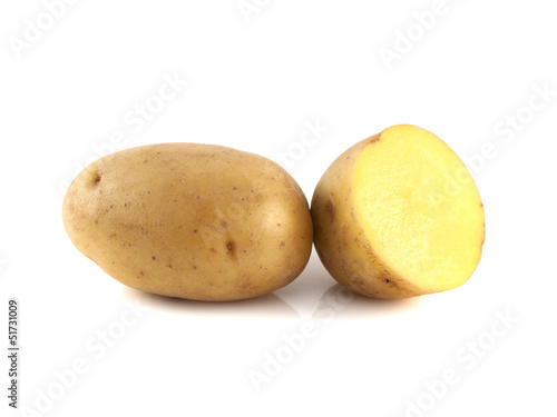 New potato with sliced half isolated on white