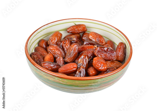 Delicious dried date fruit in bowl, isolated on white