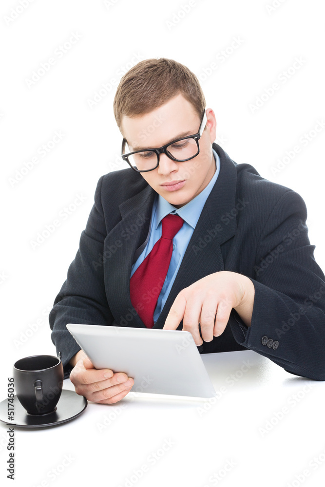 Young businessman wearing suit working on digital tablet Young businessman wearing suit working on digital tablet