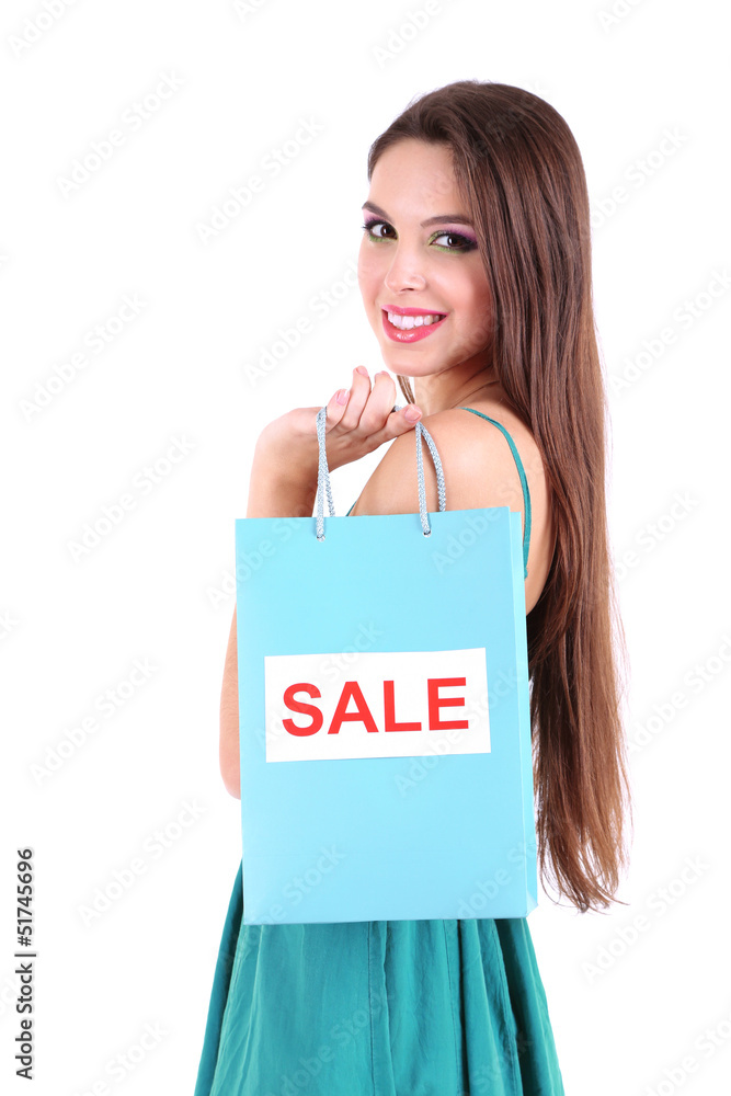 Young beautiful girl in green dress holding bright shopping Young beautiful girl in green dress holding bright shopping