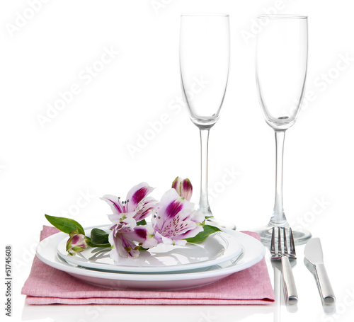 Festive table setting with flowers isolated on white