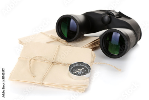 Black modern binoculars with old letters isolated on white