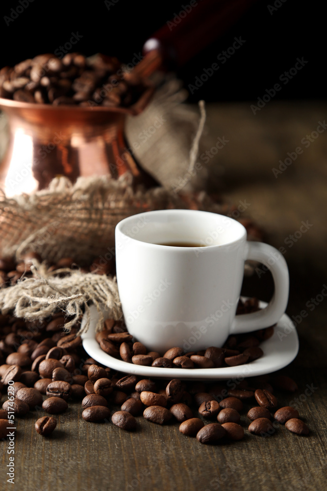 Cup of coffee and pot on wooden background Cup of coffee and pot on wooden background