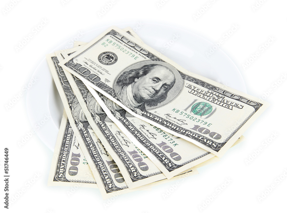 Money on plate isolated on white Money on plate isolated on white