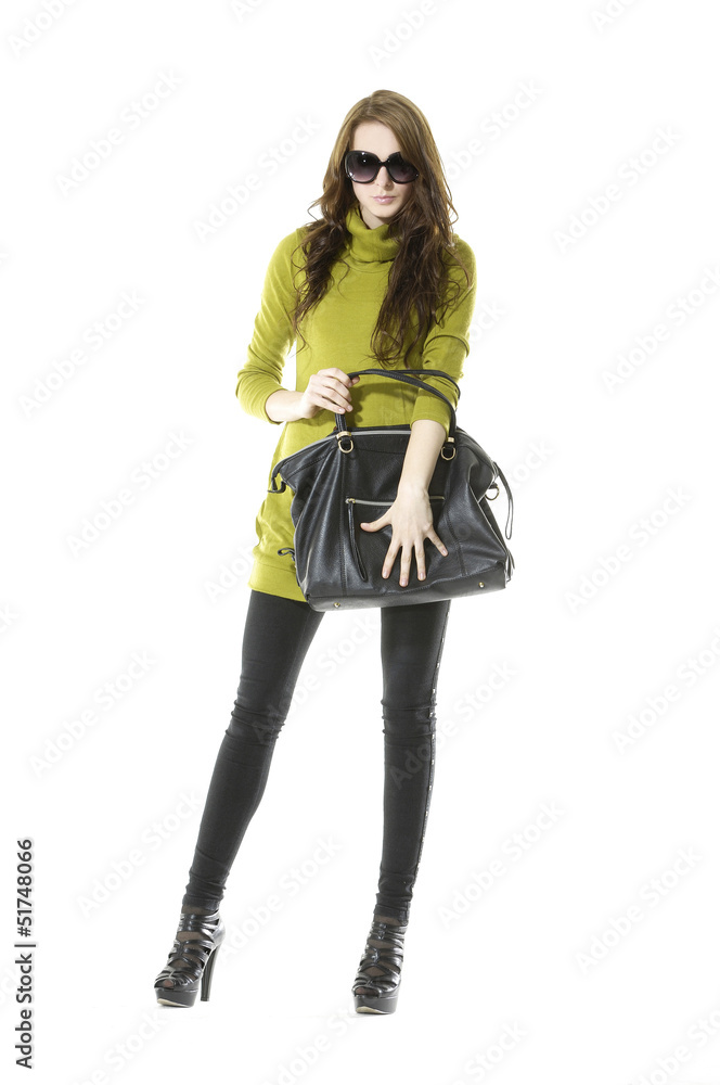 Fashion young woman in sunglasses holding black handbag Fashion young woman in sunglasses holding black handbag
