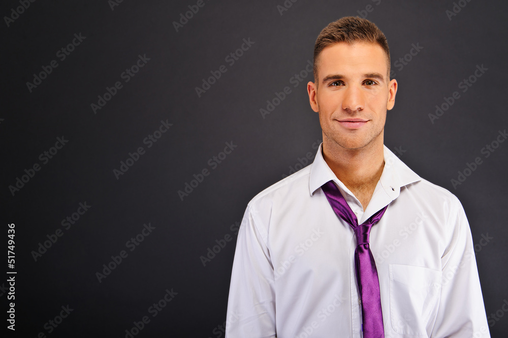 Man with white shirt over dark background Man with white shirt over dark background