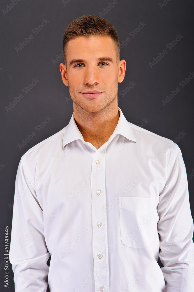 Man with white shirt over dark background Man with white shirt over dark background