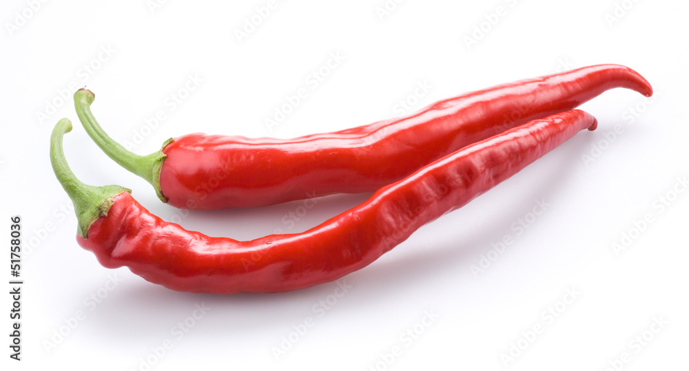 Two hot chili peppers isolated on a white background