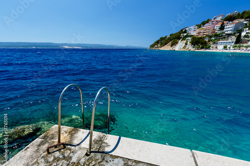 Fototapeta Naklejka Na Ścianę i Meble -  Metal Ladder on the Beach and Azure Mediterranean Sea near Split