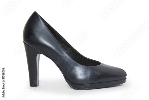 Close-up of female high-heeled shoes over white background