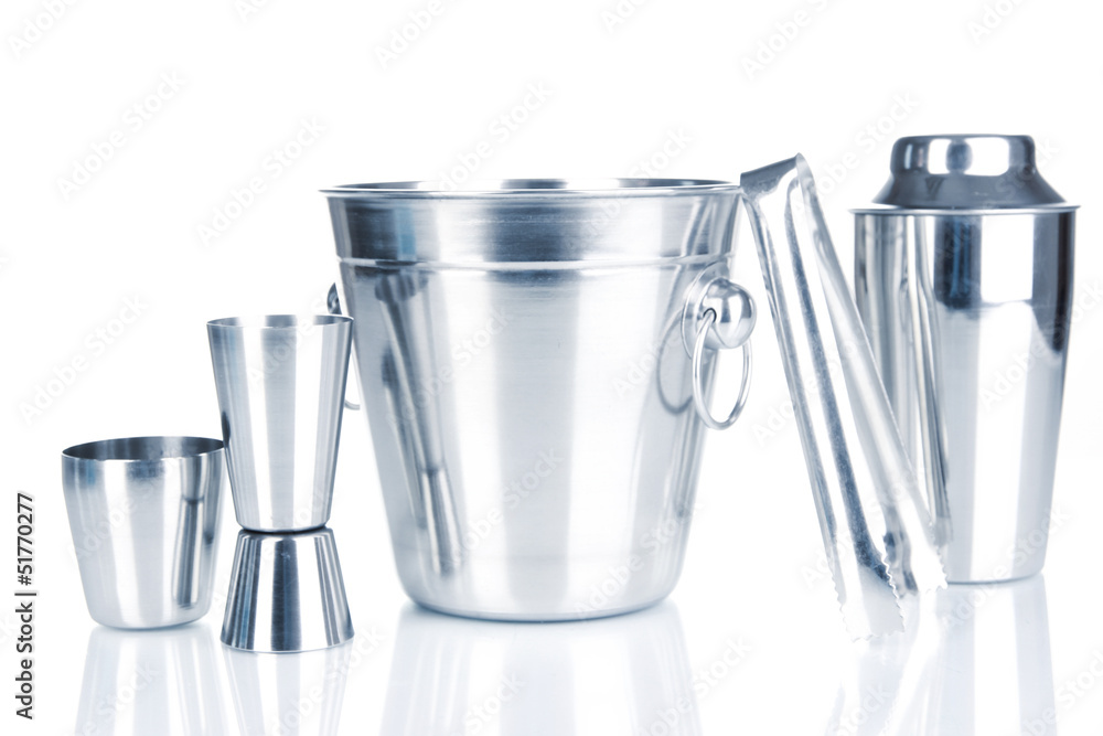 Cocktail shaker and metal ice bucket isolated on white. Cocktail shaker and metal ice bucket isolated on white.