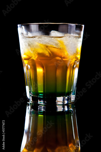 Yellow green alcohol cocktail isolated on black