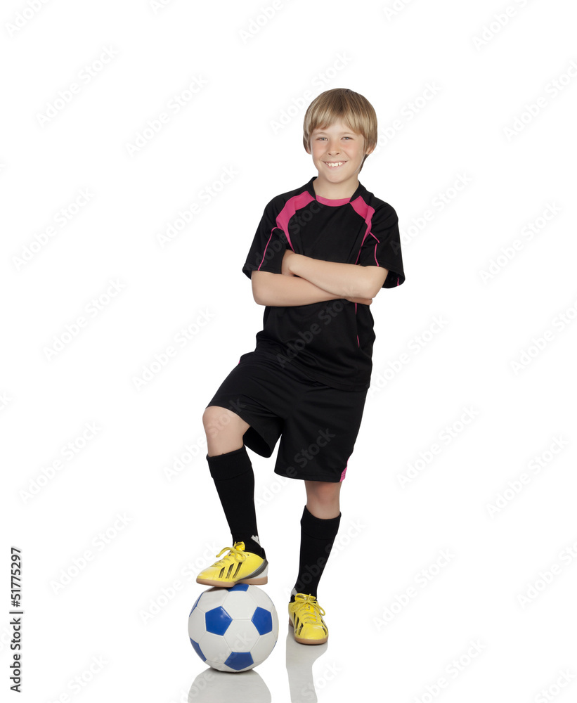 Preteen with a uniform for play soccer stepping the ball