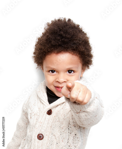 Cute child smiling and pointing at you