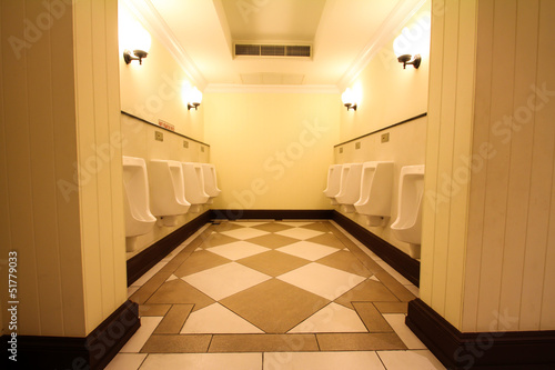 white porcelain urinals in public toilets