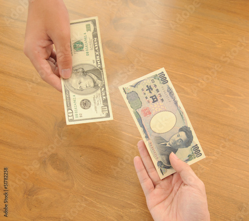 human hands exchanging money