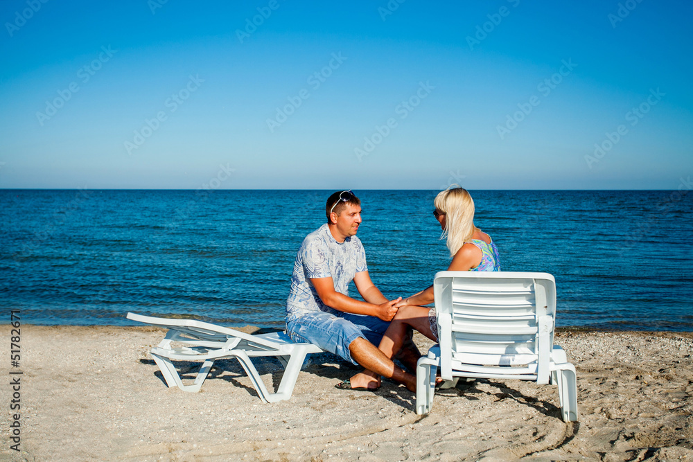 Happy couple enjoying vacations on the beach