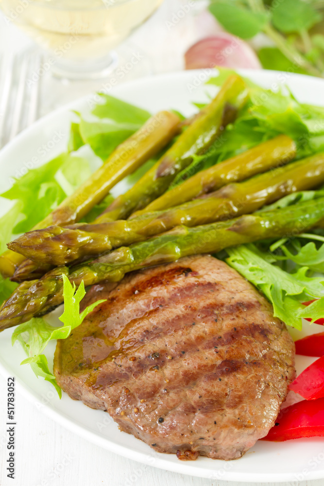 fried beef with boiled asparagus and salad fried beef with boiled asparagus and salad