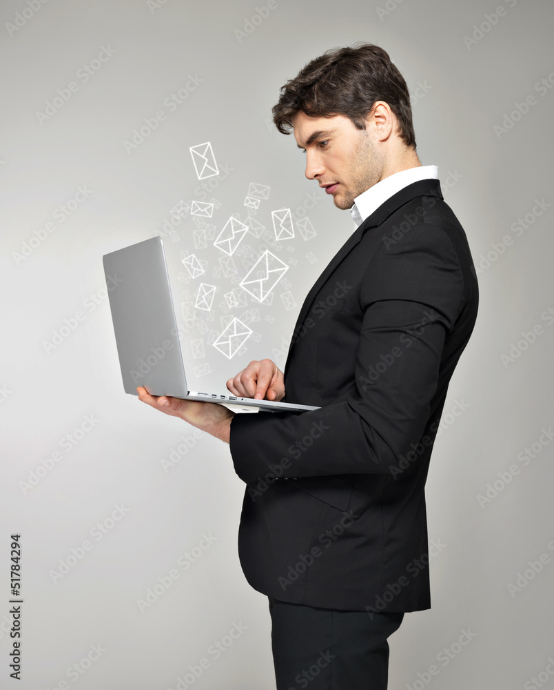Business man with laptop and mail icon Business man with laptop and mail icon