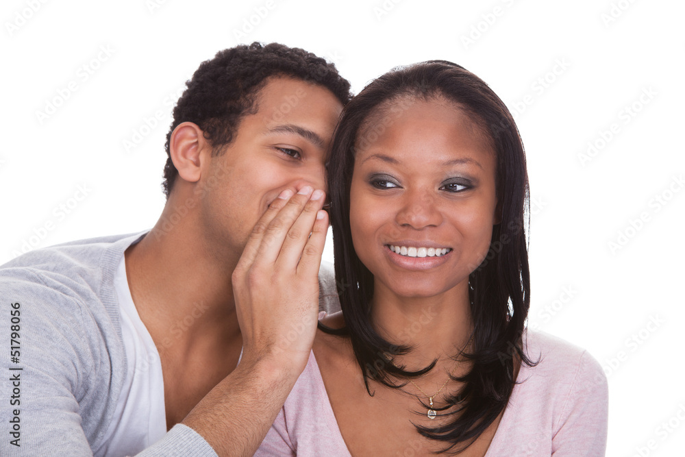 Man Whispering To Girlfriend's Ear Man Whispering To Girlfriend's Ear