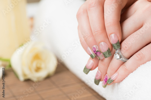 Manicured hands with engagement ring