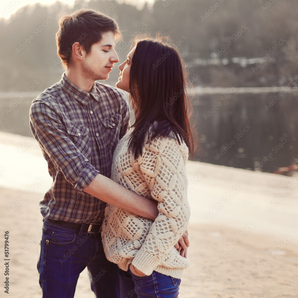 A young couple at sunset. Spring romantic portrait A young couple at sunset. Spring romantic portrait