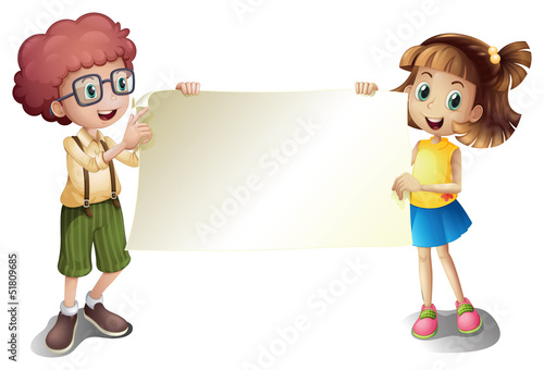 A young girl and a young boy holding an empty signboard