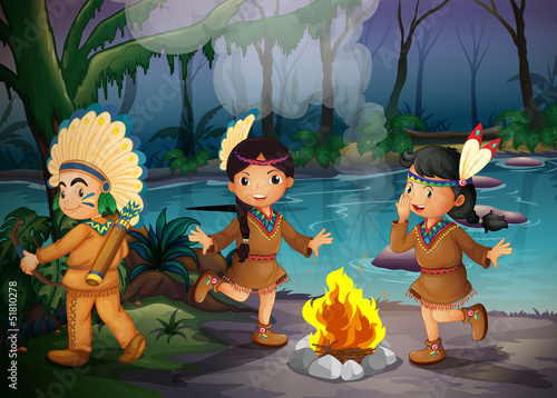 A forest with three young Indians