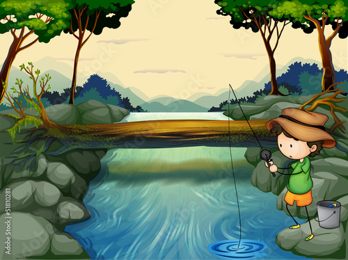 A boy fishing at the river