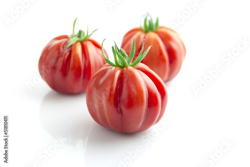Fotografiet tomatoes on white