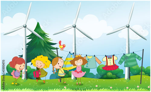 Four girls near the hanging clothes