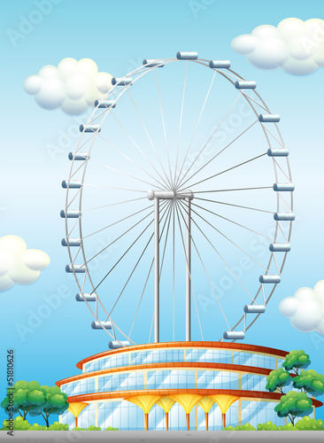 A stadium with a big ferris wheel