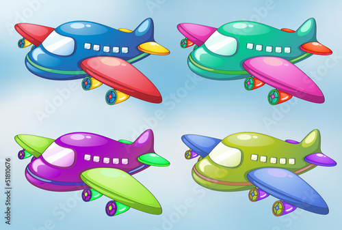 Four toy planes in the sky