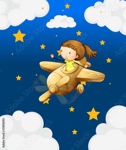 A girl riding in a wooden plane
