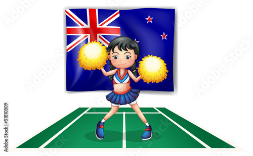 A cute cheerdancer in front of the New Zealand flag